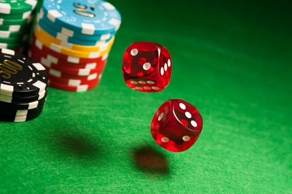 Live dealer spinning Sic Bo cage with three dice visible